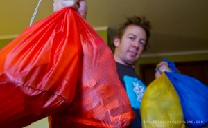 Eric Larsen packs his food into stuff sacks in Punta Arenas, Chile. 