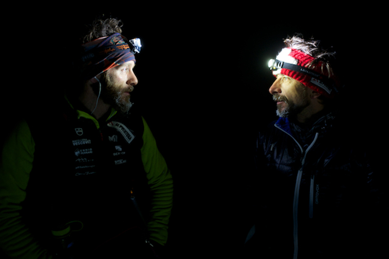 Racers regard each other during the Yukon Arctic Ultra. Photo by Martin Hadley. 