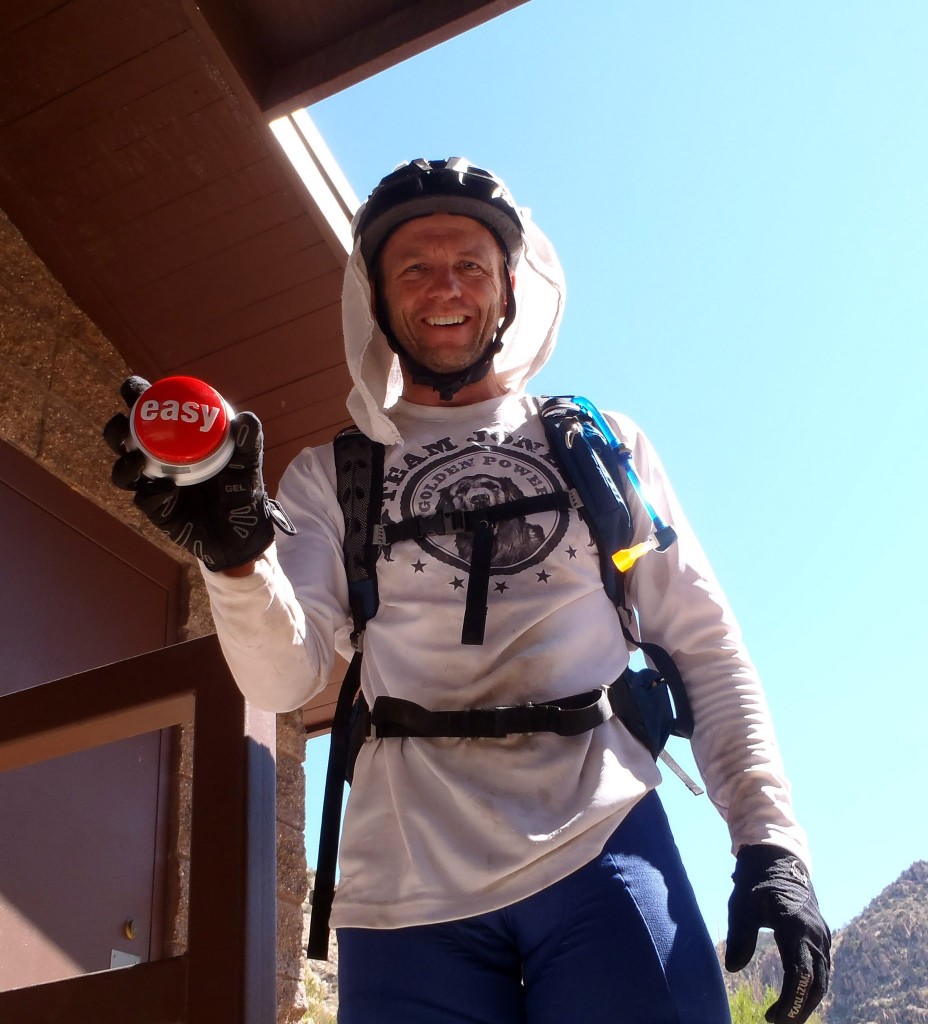After finishing up a "monster hike-a-bike," Scott Jones presents the "easy" button he'd been carrying for the occasion. Photo by John Schilling. 