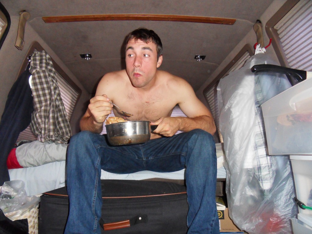 Ken Ilgunas in his van, where he lived for several semesters while attending graduate classes at Duke University. 